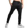Calças de treino para corrida e fitness muscular masculinas de algodão Slim Fit para primavera e outono, irmãos, calças de treino para pés, comércio exterior, leve, sem logo