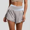 Shorts de Yoga Transfronteiriços Estilo Europeu e Americano com Blocos de Cor Falso Duas Peças, Shorts Esportivos Anti-Exposição com Sensação Nua, Calças de Fitness para Corrida para Mulheres