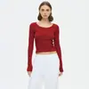 Camiseta de punto acanalado de cuello redondo con botones en el hombro recto, moda 2025 para mujer, color liso, top versátil de manga larga para ir al trabajo