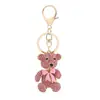 Colgante de Mochila de Oso de Diamantes Completos Coreano Nuevo Llavero de Coche Colgante de Aleación con Lazo de Color Wholesale de Yiwu