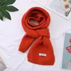 Comercio exterior nuevo estilo bufanda de lana tejida de color liso otoño e invierno nueva versátil para estudiante pareja cálida bufanda larga venta al por mayor