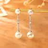 Pendientes de botón largos de circón y perla de temperamento elegante, moda de alta gama, pendientes versátiles para el día a día, sentido de la atmósfera, colgantes de oreja para dama
