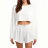 Conjunto de pijama casual feminino transfronteiriço com design vazado, moderno, simples, de corte solto, com blusa de manga longa e shorts