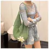 Nova Bolsa de Tricô de Verão 2026 Tendência Bolsa de Palha Tecida Feminina Bolsa de Ombro Único em Rede Bolsa de Viagem Portátil para Passeios na Praia