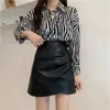Mini falda plisada de cuero marrón para mujer, versión coreana otoño e invierno 2026, falda de línea A adelgazante de cintura alta, falda corta, media falda bodycon de PU