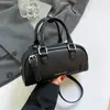 Bolsa de mão de boliche feminina única 2026 novo modelo de primavera bolsa de ombro simples transversal bolsa almofada da moda
