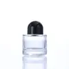 Botella de perfume cilíndrica de vidrio transparente botella secundaria de perfume botella con pulverizador de presión de alta gama portátil muestra cosmética botella vacía