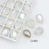 Dongzhou Cristal Nieve Proteína Arte de Uñas Diamante Brillante Blanco Proteína Huevo de Paloma Fondo Puntiagudo Diamante Dongzhou Diamante Wholesale Accesorios para Arte de Uñas
