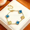 Pulsera de acero de titanio con trébol de cuatro hojas de la suerte para mujer, color dorado, doble cara, un artículo popular transfronterizo, con un diseño de nácar, y un estilo nuevo, moderno y versátil para los mercados europeo y americano.