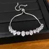 Pulsera extensible ovalada chapada en oro real con incrustaciones de circonita, sensación de lujo ligero de nicho de alta gama, accesorio de mano simple y elegante