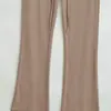 Venta al por mayor de ropa para mujer estilo europeo y americano transfronteriza INS, nuevos pantalones acampanados elásticos de otoño de cintura alta con cordones y costuras visibles