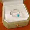 Anillo ovalado abierto de piedra, sensación de alta gama nicho, simple y elegante, único y moderno, joyería versátil al por mayor