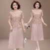 Vestido de Moda Estilo Chino Nuevo 2026 para Mamás, Elegante y Noble Vestido de Mujer de Longitud Media Adelgazante Falso de Dos Piezas