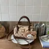 Bolso tipo almohada 2025 Nuevo, Bolso de mano cruzado de alta gama estampado, Bolso pequeño versátil, Bolso cruzado popular para mujer de este año