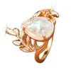 Anel bestseller transfronteiriço em ouro rosé com ramo e gota d'água opala branca, anel vintage oco floral com opala