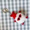 Al por mayor spot nuevo colgante de felpa llavero colgante de muñeca pequeña colgante de muñeca de dibujos animados colgante de rana