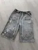 Pantalones cortos casuales con estampado de letras Harajuku desgastado y diseño rasgado para hombres y mujeres, pantalones deportivos con cordón de estilo callejero, modernos