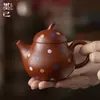 Tetera de Gama Alta Estilo Chino para Uso Doméstico con Filtro de Agujeros Redondos, Hecha de Arcilla Zhu Ni con Puntos Ondulados, Adecuada para Té Kung Fu