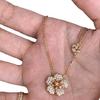 Collar y pulsera de doble flor de diamantes de estilo chino nuevo retro, ligero, de lujo, exquisito temperamento, diseño de estilo nacional de alta gama, traje dulce