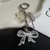 Nuevo y exquisitamente elegante correa para teléfono de nudo de lazo y hueso de serpiente, llavero corto versátil y accesorio para bolso