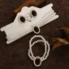 Collar y pulsera de perlas de imitación con flor de diamante francés, cadena de clavícula de nicho de moda, joyería de alta gama que combina con todo.