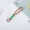 Cordón para teléfono móvil transfronterizo, llavero de cuerda tejida corta creativa, cordón colgante desmontable anti-pérdida, cordón para teléfono móvil anudado con bloques de color