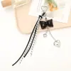 Nuevos Accesorios de Cadena Colgante para Equipaje Llavero Colgante con Colgante de Corazón con Lazo de Cuero Nuevo Hebilla Única Accesorios con Colgante de Borla