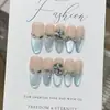 Um Conjunto de Unhas Postiças Cool e Deslumbrante com Gradiente Azul Sal Marinho Transparente Estilo Gatinho Bordado com Strass