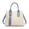 Bolsa de mano transfronteriza, bolso de mano para mujer con bloques de color de moda, bolsa simple de gran capacidad para el día a día, bolsa para mujer al por mayor de comercio exterior personalizada