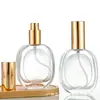 Botella de Perfume de Vidrio Plano Ovalada Transparente con Atomizador Negra Tapa de Aluminio Anodizado Botella de Recarga de Perfume
