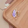 Nuevo colgante de mariposa de aleación, accesorios para joyería DIY con incrustaciones de perlas huecas, materiales de accesorios personalizados estilo antiguo al por mayor