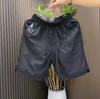 Pantalones cortos deportivos finos y transpirables de verano de secado rápido para hombre, de malla de color sólido, informales, holgados, para playa