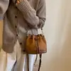 Bolso de mujer con cierre de cordón 2026 nuevo elegante de moda bolso de mano tipo cubo para ir al trabajo, bolso bandolera vintage de un solo hombro