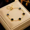 Comercio electrónico transfronterizo trébol de la suerte de cinco hojas pétalo de doble cara collar de oro pendientes pulsera collar traje de joyería para mujer venta al por mayor