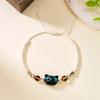 Libro Rojo mismo estilo lindo brazalete de gatito negro para hombres y mujeres pareja cuerda trenzada diseño nicho regalo para novias