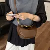 Bolso pequeño de alta gama de nicho para mujer 2026 nueva moda casual bandolera cruzada bolso de media luna versátil bolso tipo empanada