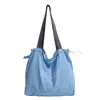 Bolsa de tecido grande estilo universitário para mulheres 2026 nova moda primavera e verão bolsa de ombro única leve simples versátil bolsa tote