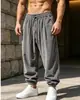 Calças Jogger Masculinas de Veludo Cotelê Europeias e Americanas Outono e Inverno Largas com Cordão Calças Harem Retrô Caimento Fluido Casuais Curtas Masculinas