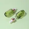 Venda Direta de Fábrica Frasco de Essência 20ml Frasco Transparente Verde para Óleo Essencial Frasco de Vidro para Água de Essência Conta-gotas Óleo de Limpeza em Estoque