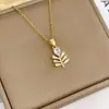 Brincos de Escada em Forma de Gota de Folha com Banho de Cobre Ouro Real Europeus e Americanos Conjunto de Decoração com Pingente de Folha Full Diamond Versátil