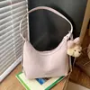 Bolso de mujer de alta calidad transfronterizo, nuevo modelo primavera 2026, diseño de nicho, bolso de hombro simple para llevar debajo del brazo, bolso tipo empanada