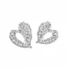 Aretes de botón con forma de corazón hueco de circón con pasador de plata, lujo ligero y alta gama, elegancia francesa, aretes de mujer elegantes y versátiles