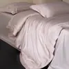 Juego de ropa de cama ultra suave de encaje de color liso de alta gama estilo minimalista italiano, juego de textiles para el hogar de cuatro piezas de algodón Tencel, Kelly