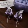 Pendientes de Clip para Auriculares Bluetooth Freeclip Zirconia Super Brillante Mariposa Borla Larga Clip para Oreja Pendientes de Moda DIY para Mujeres