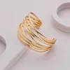 Amazon transfronterizo nueva personalidad simple semicírculo versión ancha pulsera de torsión dorada diseño temperamento banquete accesorios de regalo