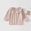 Top suave, con volantes y cuello redondo para niñas, con diseño de cara sonriente, hipoalergénico y elástico, adecuado para bebés y niños pequeños como una cómoda capa base para usar en casa.