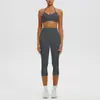 Conjunto deportivo de yoga con sujetador de yoga sin costuras de nuevo estilo transfronterizo con relleno incorporado, alta elasticidad, secado rápido y pantalones capri para correr