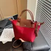 Bolsa Feminina 2026 Nova Tendência Estilo Coreano Versátil Grande Capacidade Bolsa Tote para o Dia a Dia Bolsa de Mão Bolsa Dumpling Bolsa de Ombro Transversal