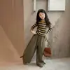 Ropa para niñas: Camiseta base de manga larga a rayas con pantalones casuales, talla 26, nuevo estilo para primavera y otoño, suministro de comercio exterior
