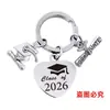 Pingente de Chaveiro Aço Inoxidável Coração Cruz Europeia e Americana Chapéu de Formatura Transfronteiriço Presente Temporada de Formatura 2026 Chaveiro de Metal Gravado